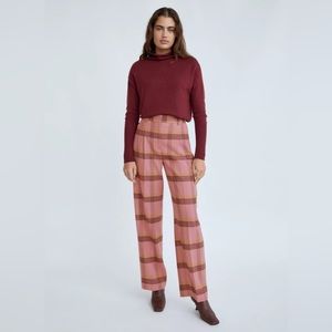 high-rise pants with front knife pleats, slash hand pockets, long, wide leg.